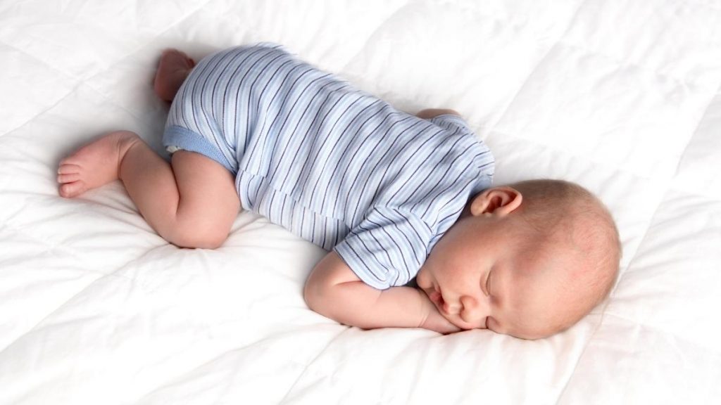 baby sleeping with face down in mattress